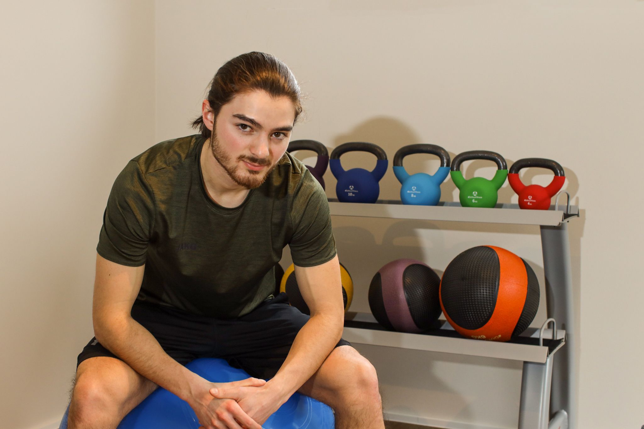 Trainer with kettlebells